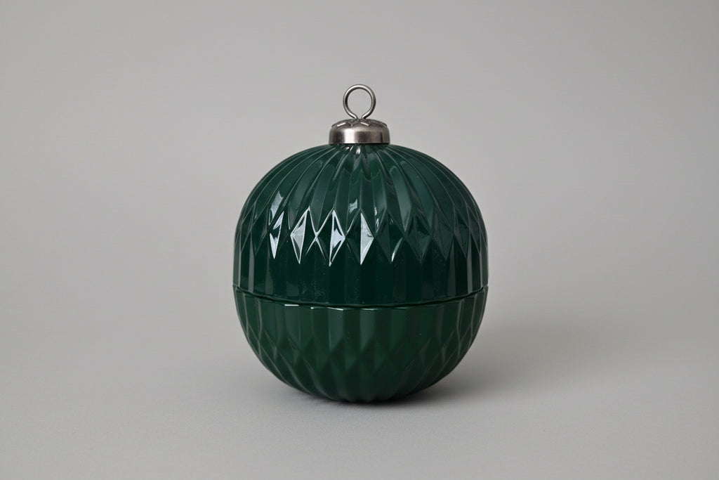 Green textured decorative ball on a white surface