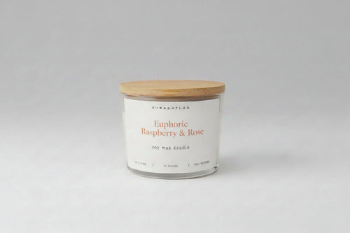 Candle with wooden lid on a white background