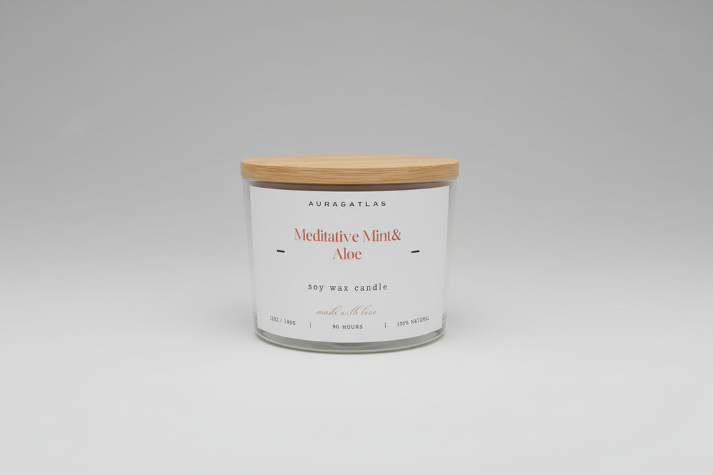 White candle with wooden lid on a white surface