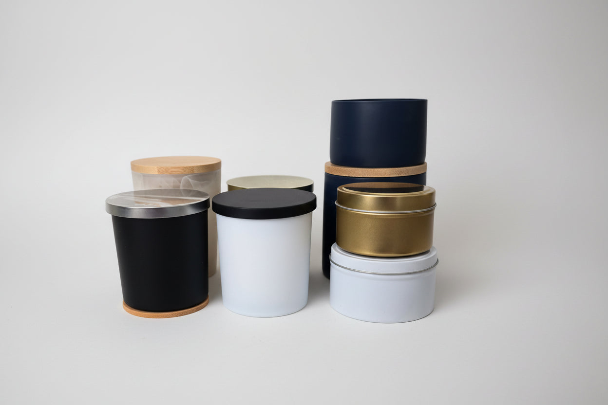 Set of black, gold, and white tape rolls on a white surface