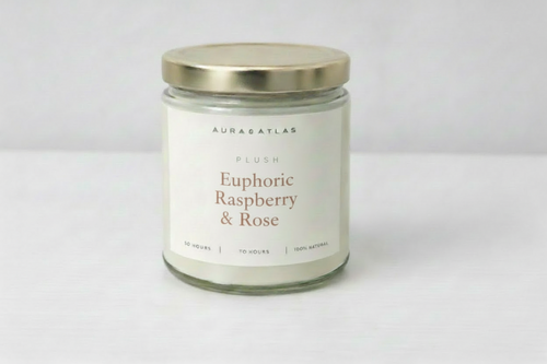 Candle jar labeled 'Jasmine Tea & Bamboo' by Aura Atlas on a white background