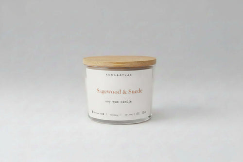 Candle with wooden lid on a white background