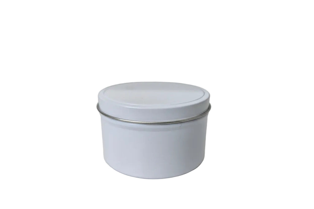 White cylindrical container with a lid on a light gray surface